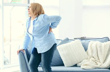 Senior woman suffering from back pain